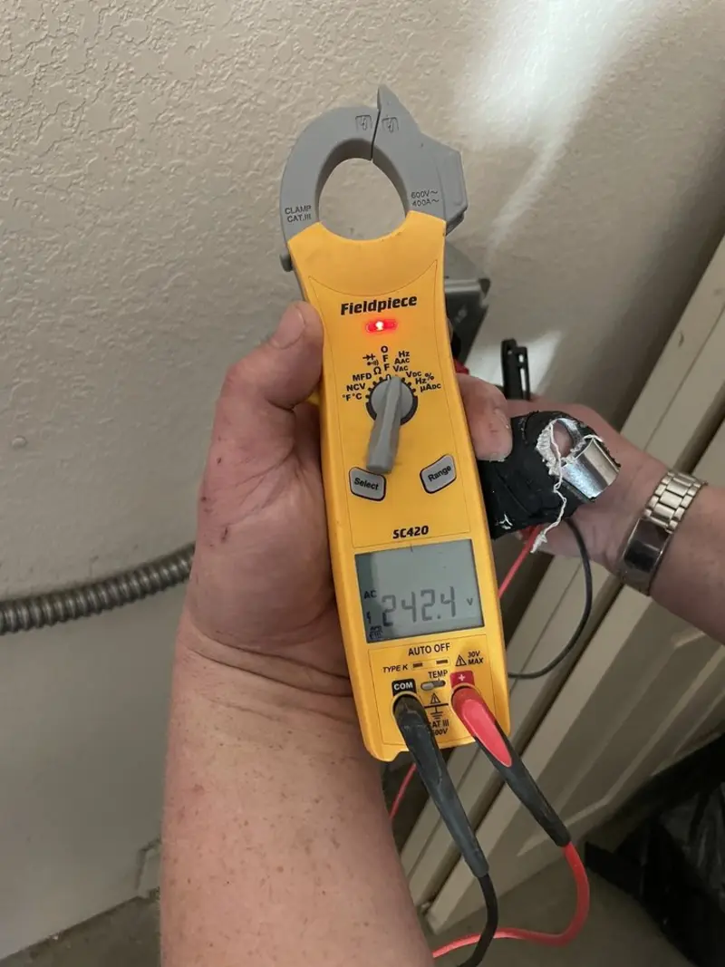 Voltage testing with clamp meter during Recessed Lighting Installation in Difficult Run